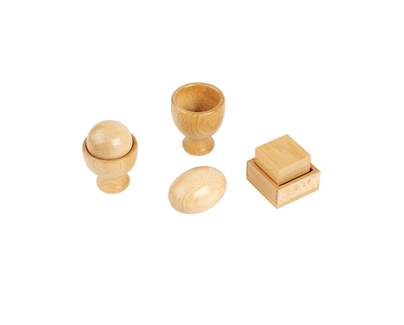 Taza con huevo y pelota. Cubo con caja