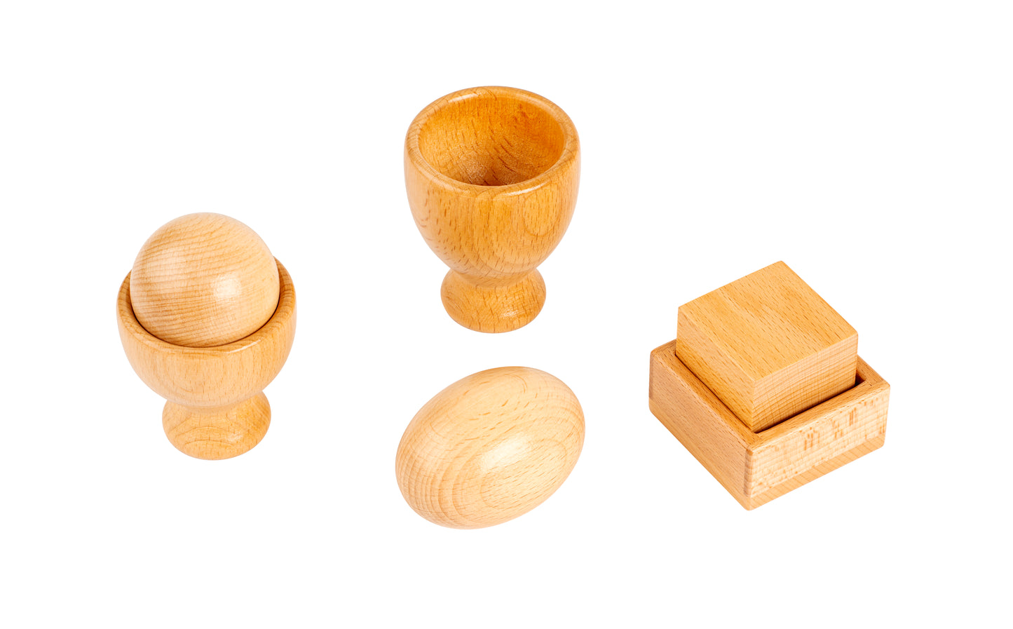 Taza con huevo y pelota. Cubo con caja